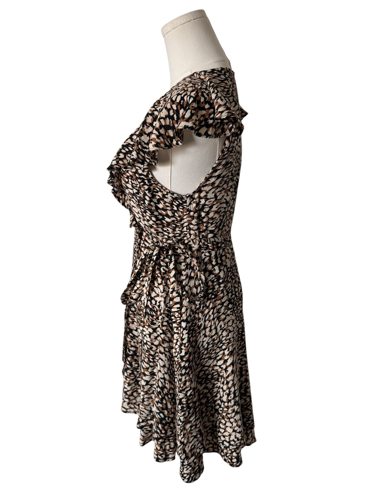 Leopard print dress on a mannequin against a white background