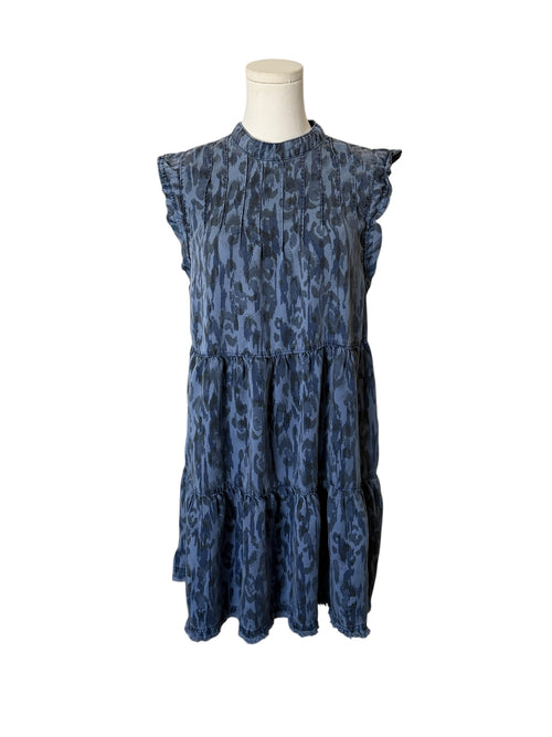 Blue patterned dress on a mannequin against a white background