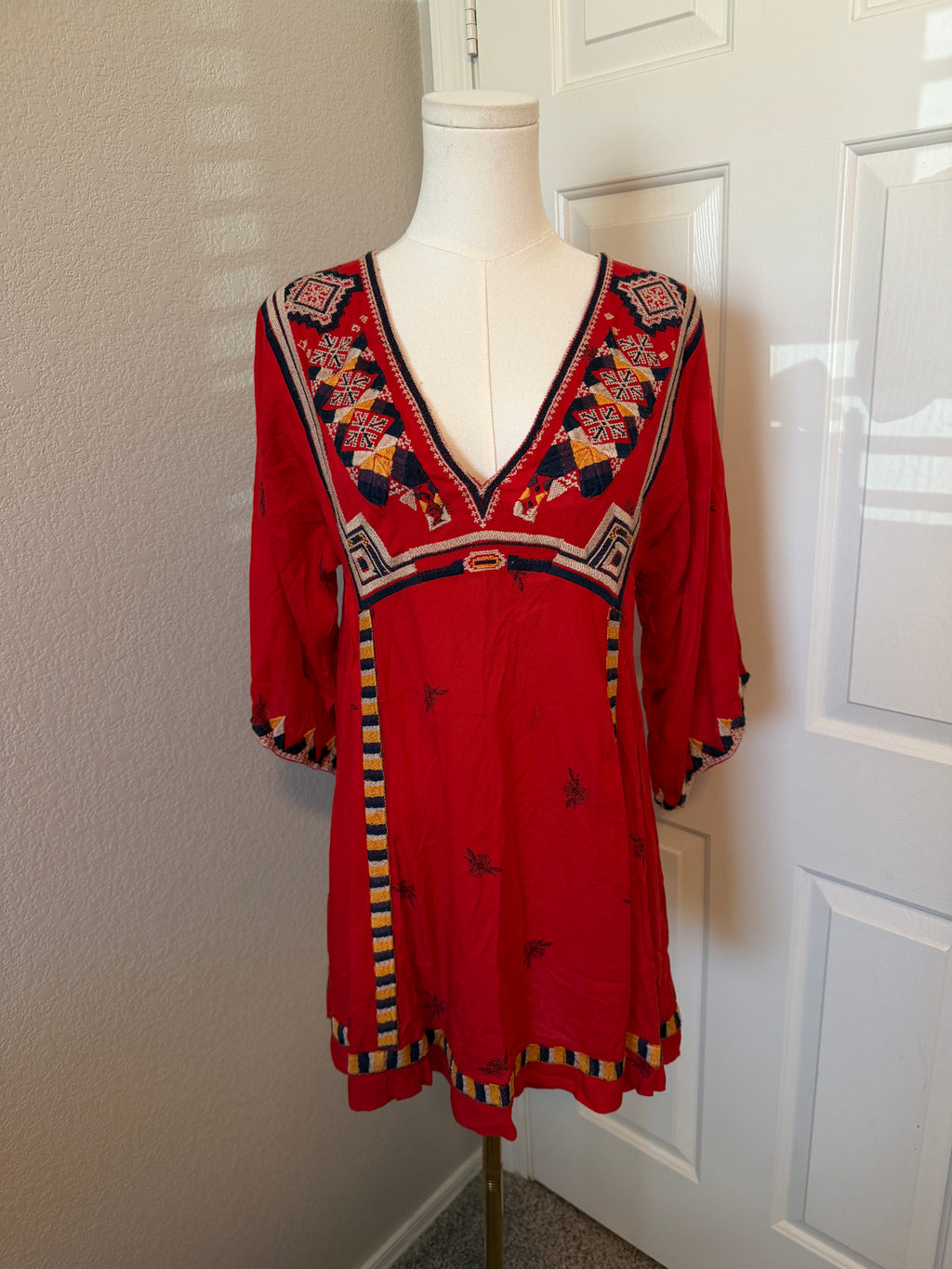 Free People Tulum mini dress features vibrant geometric embroidery
