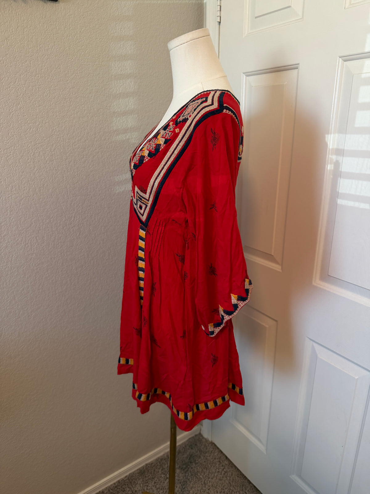 Free People Tulum mini dress features vibrant geometric embroidery