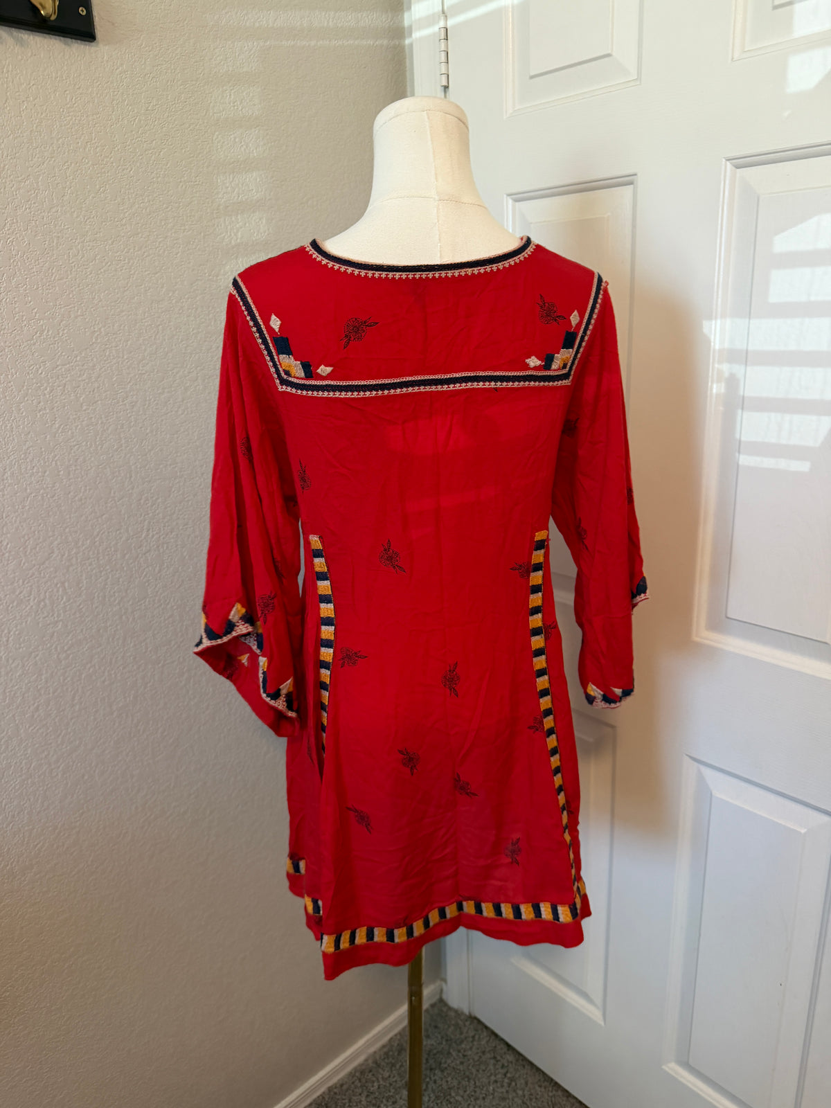 Free People Tulum mini dress features vibrant geometric embroidery