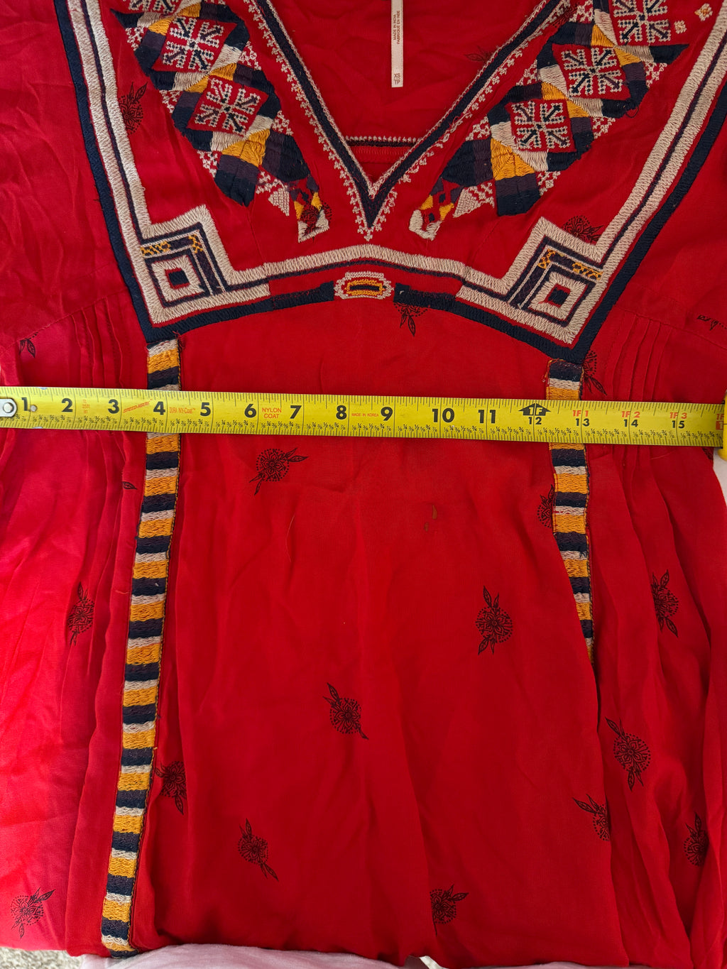 Free People Tulum mini dress features vibrant geometric embroidery