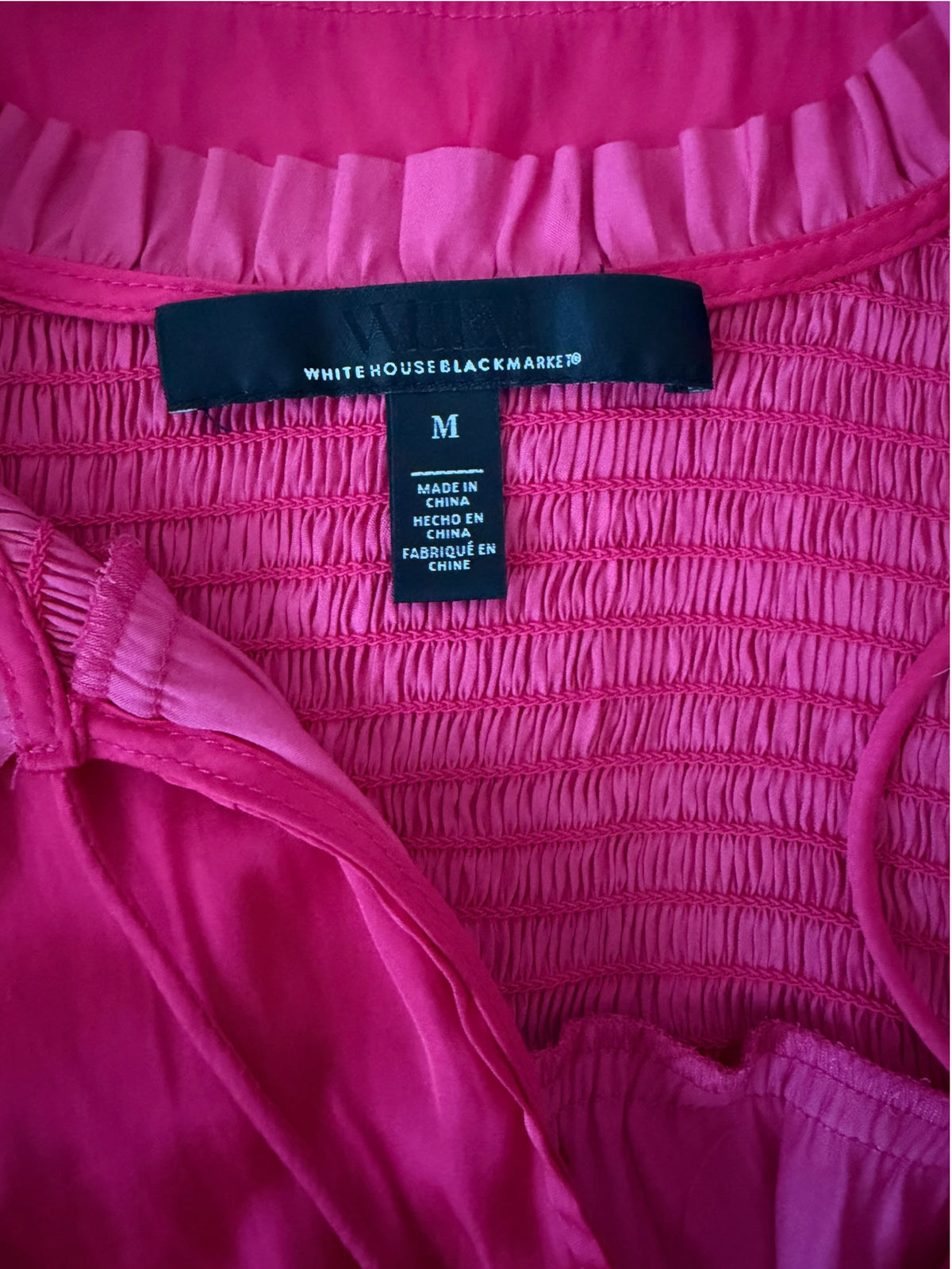 vibrant fuchsia pink long-sleeve blouse from White House Black Market