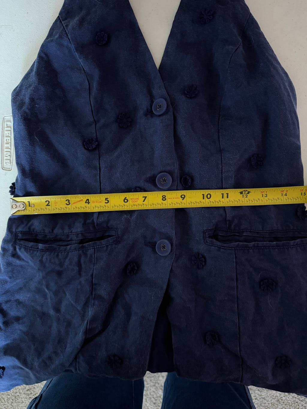 Maeve for Anthropologie navy blue halter vest featuring 3D floral appliqués