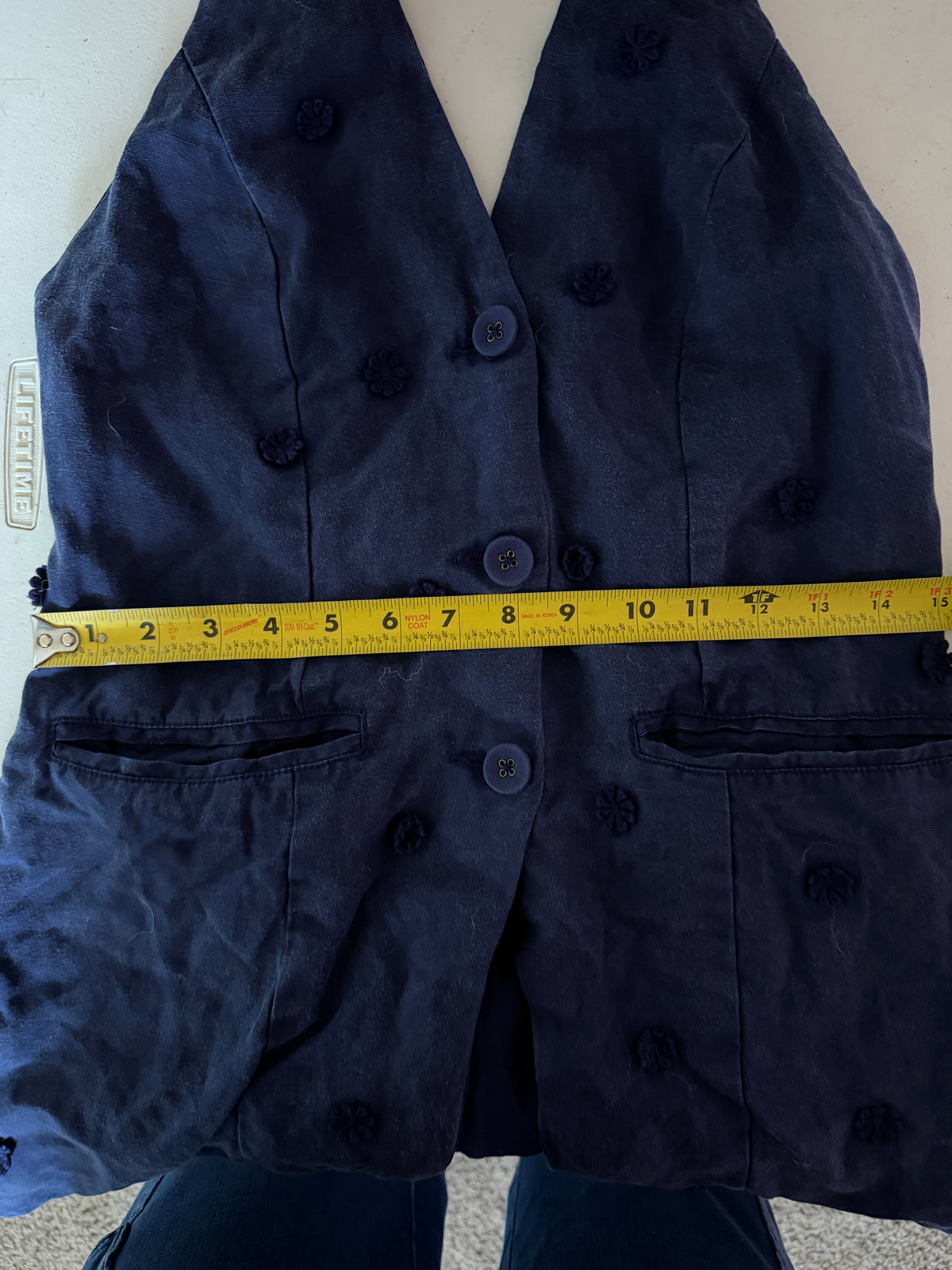 Maeve for Anthropologie navy blue halter vest featuring 3D floral appliqués