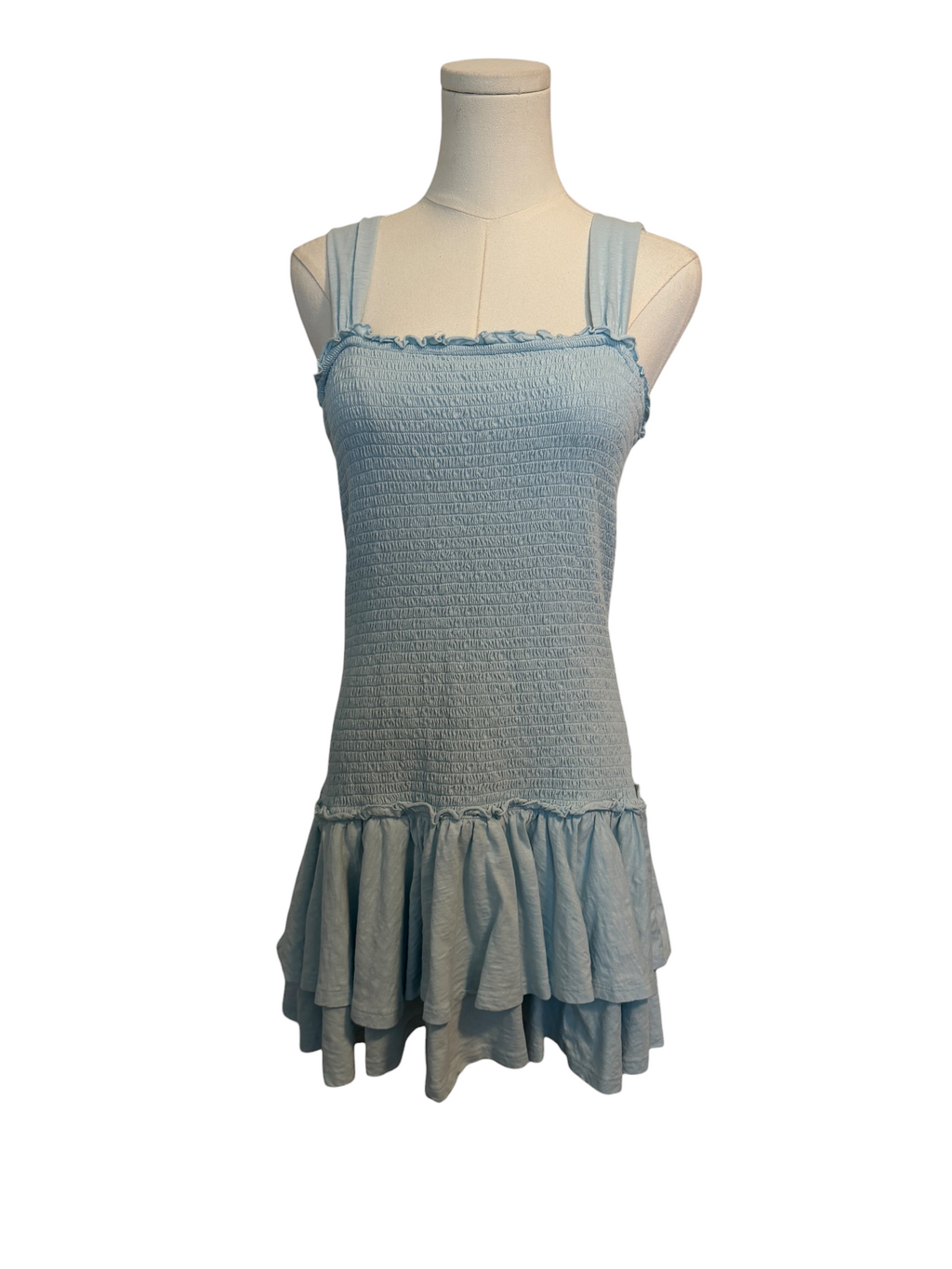 Light blue dress on a mannequin against a white background