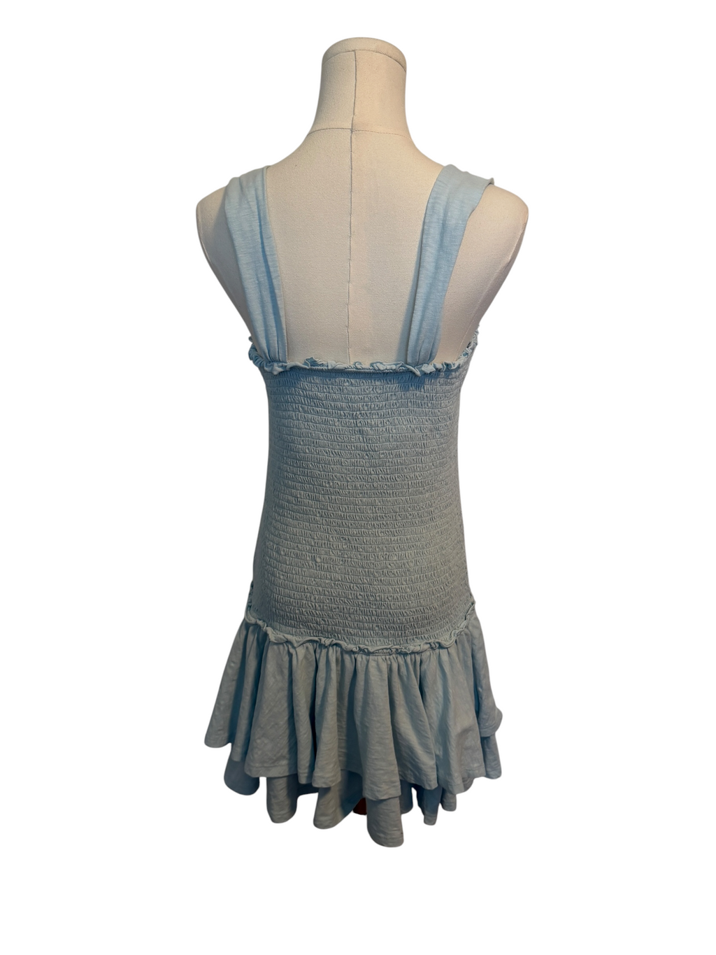 Gray dress with sheer blue straps on a mannequin against a white background