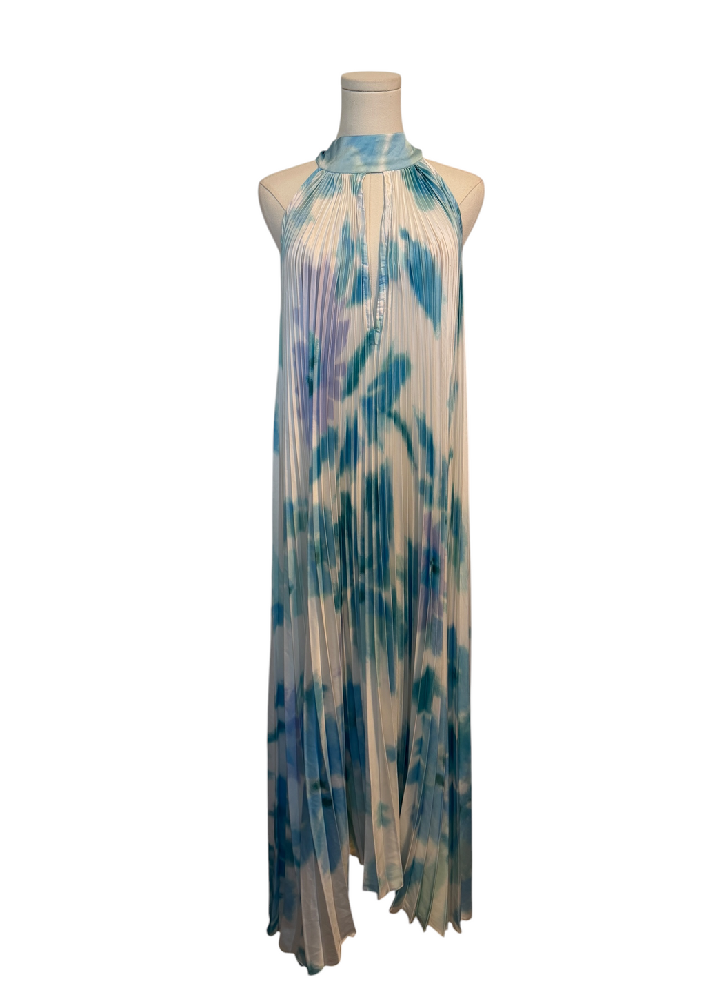 Tie-dye dress on a mannequin against a white background