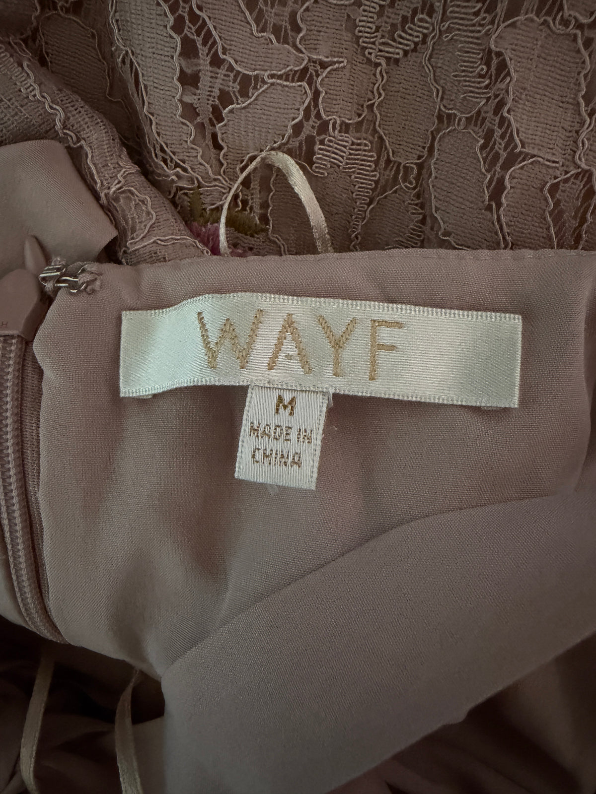 Wayf Ferrara Lace Dress in a blush color, featuring delicate floral embroidery