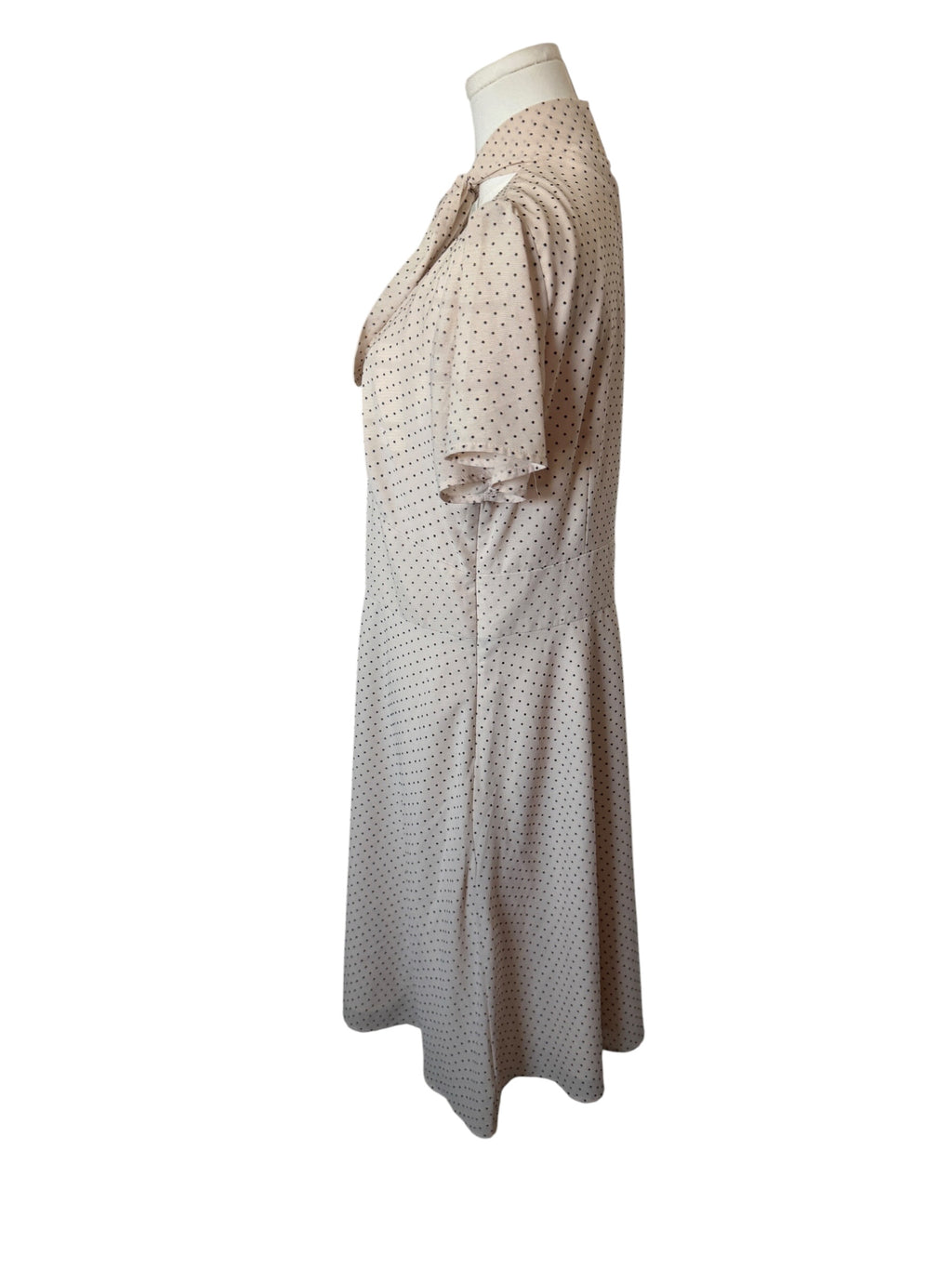 Maggy London cream-colored polka dot dress features a tie-neck detail