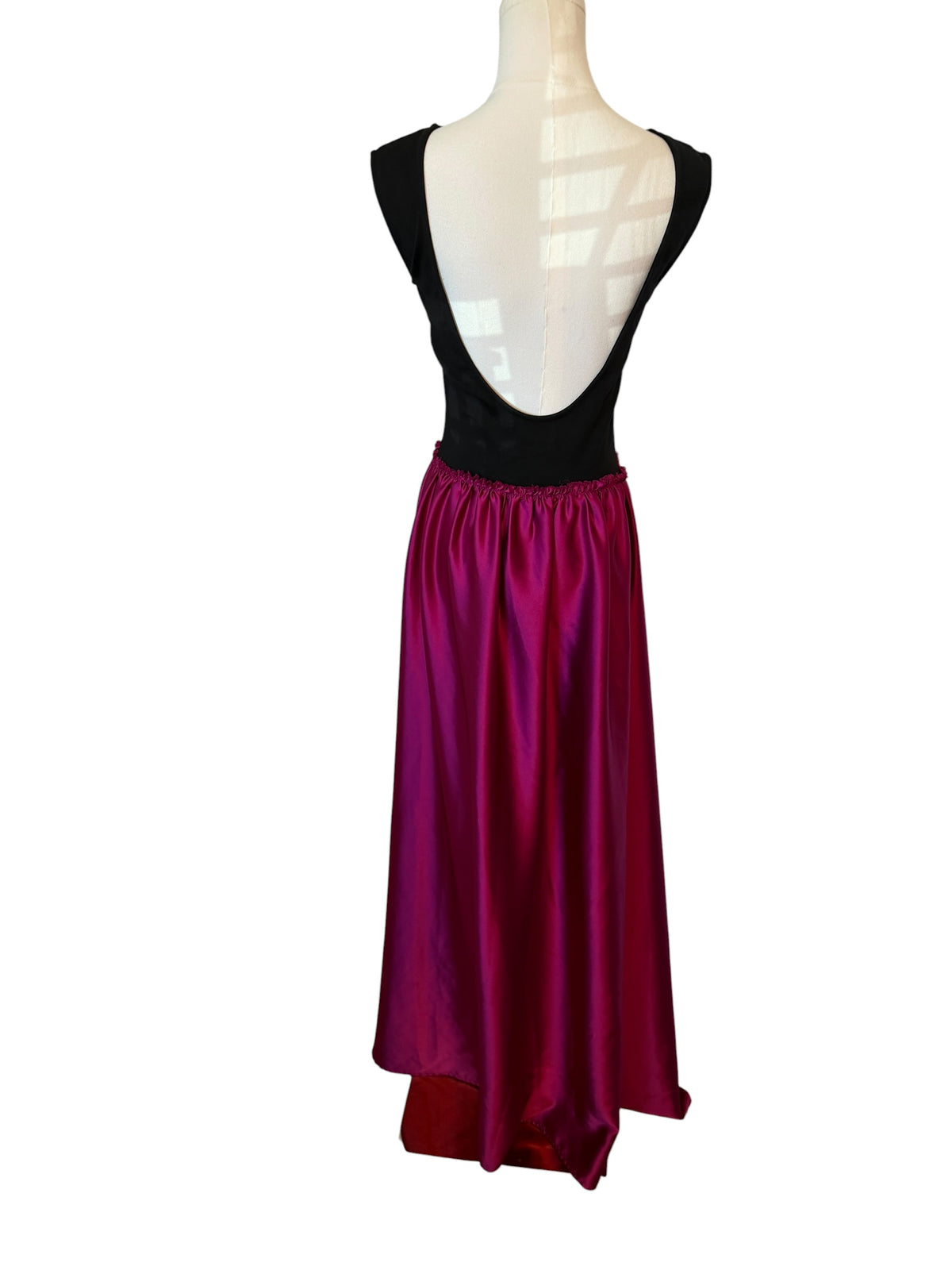 Ripley Rader Ashley Satin Dress with a vibrant magenta skirt.