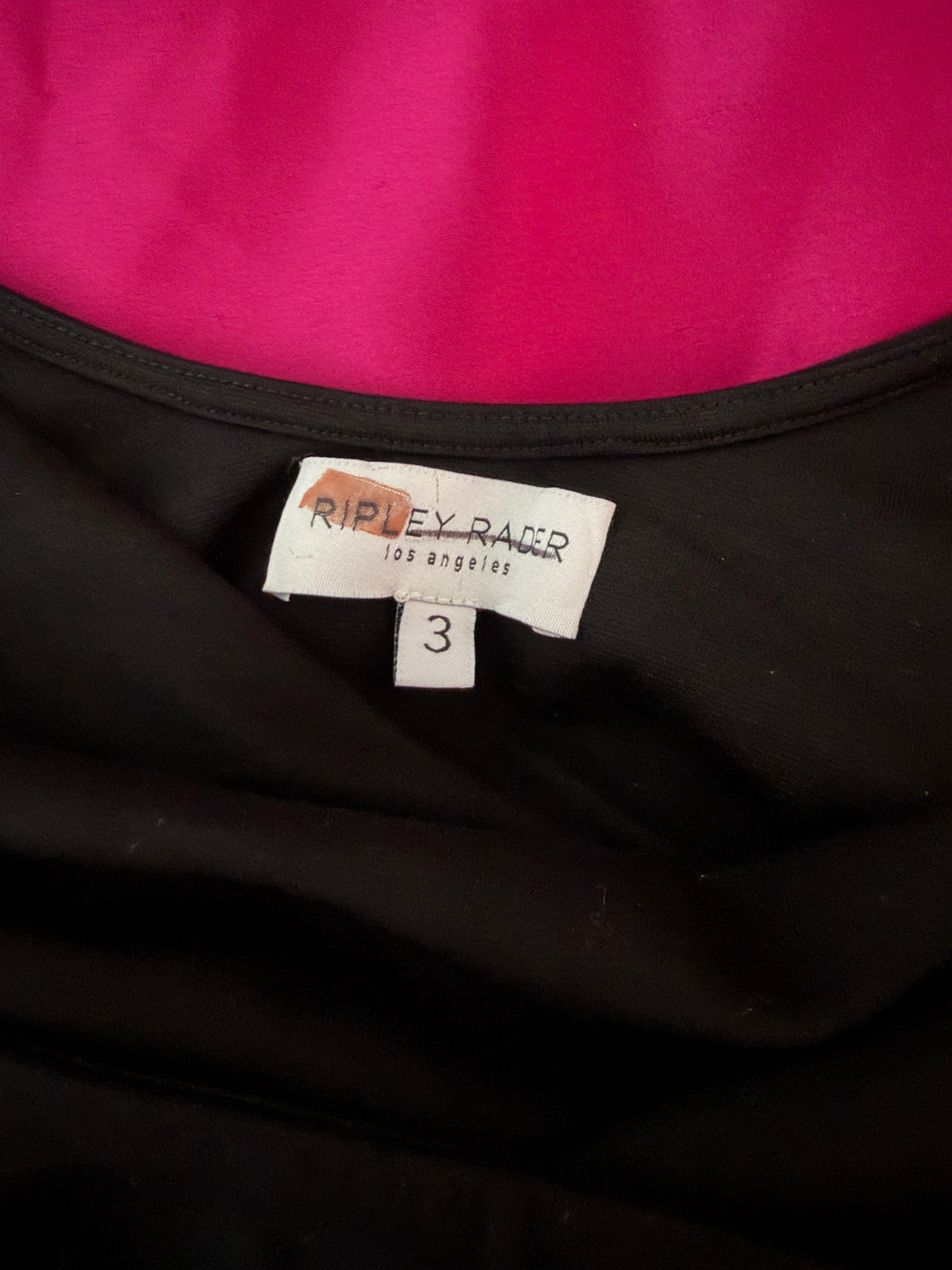 Ripley Rader Ashley Satin Dress with a vibrant magenta skirt.