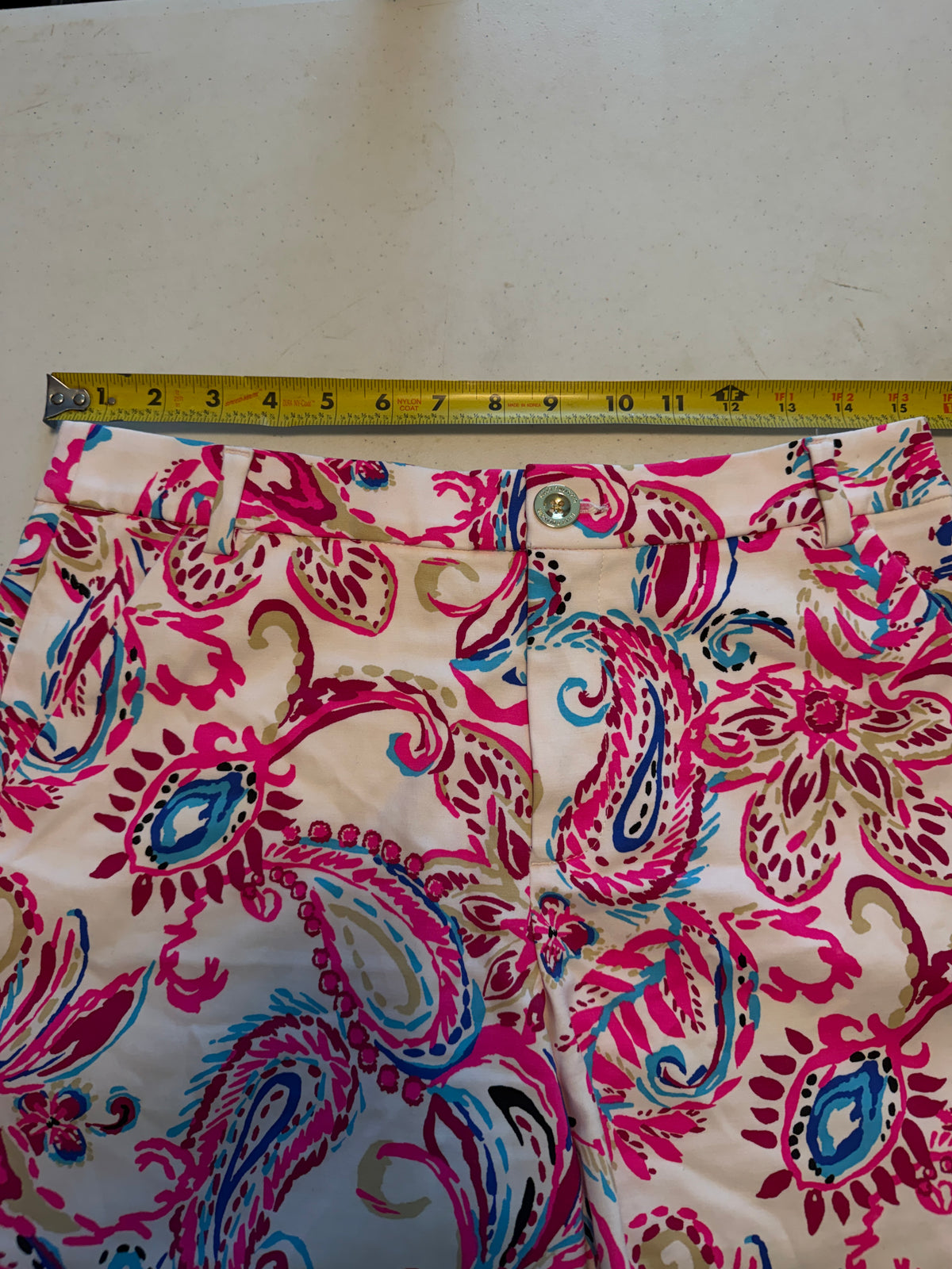 Lilly Pulitzer shorts feature a vibrant pink paisley print