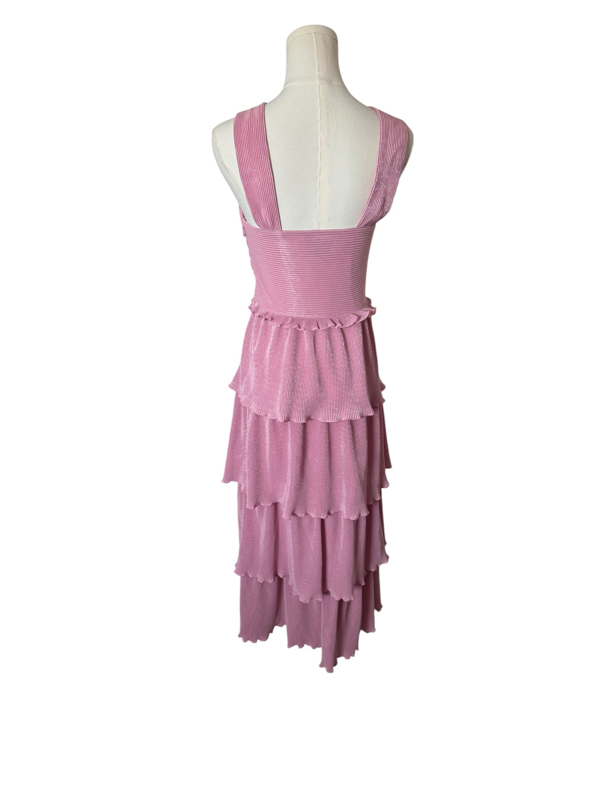 A pink tiered sleeveless dress displayed on a white mannequin torso against a plain white background.